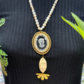 Adorned Crown Jewelry assemblage pearl intaglio cameo scrimshaw necklace