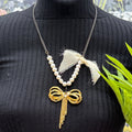 Adorned Crown Jewelry assemblage pearl gold bow necklace